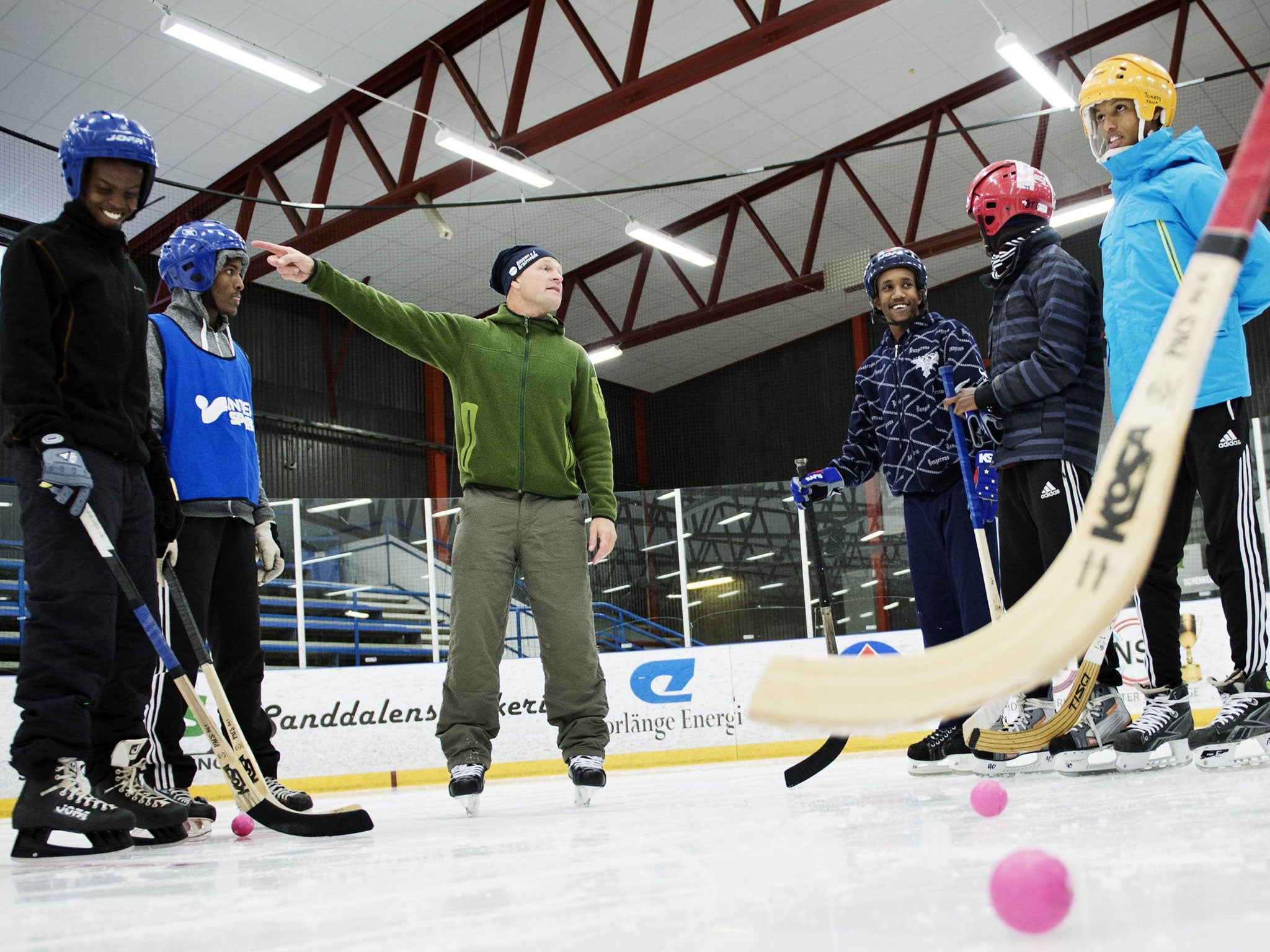 The Somali ice-bandy team practising with coach Per Fosshaug in Sweden