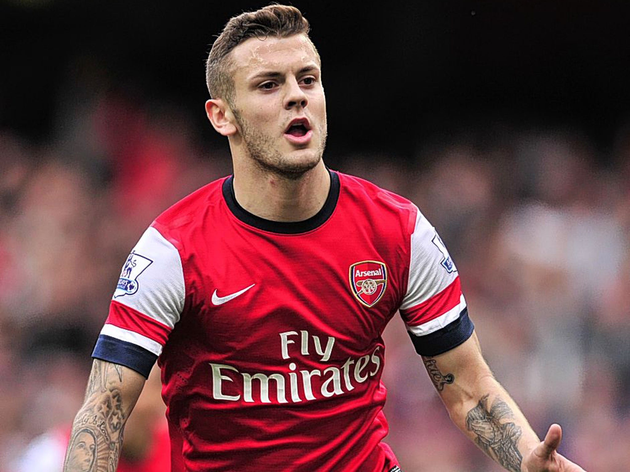 Jack Wilshere celebrates after scoring against Norwich City