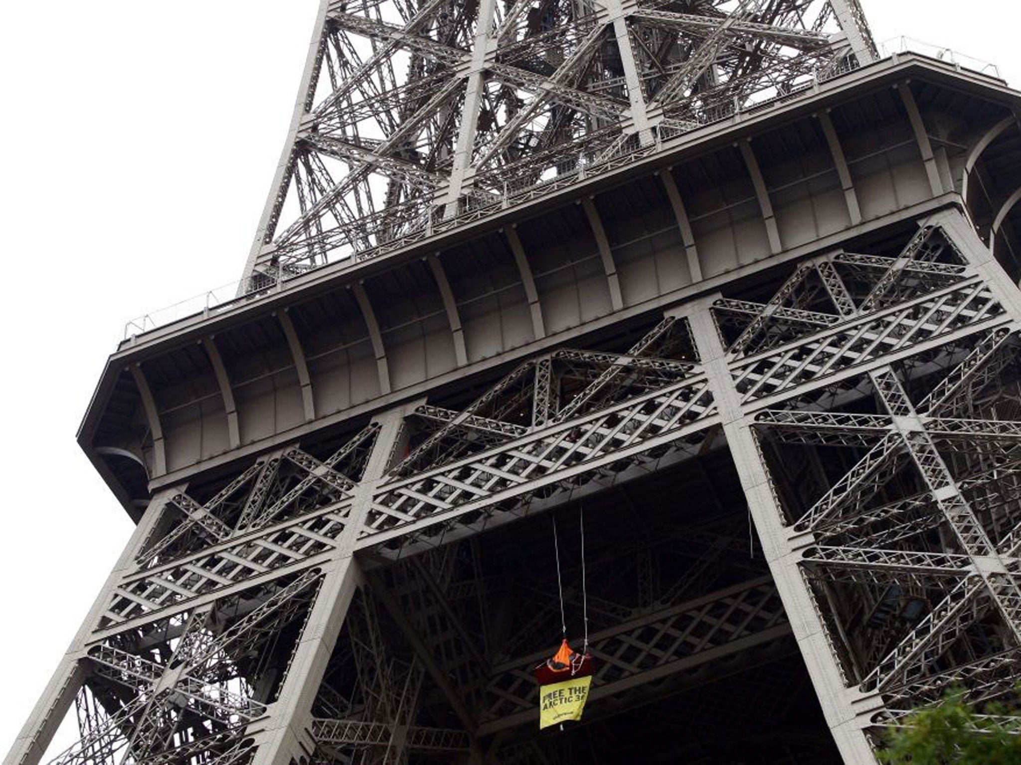 The Greenpeace banner hanging from the Eiffel Tower today