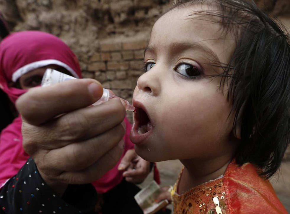 Safe solution: A girl is immunised in Pakistan, where polio remains endemic
