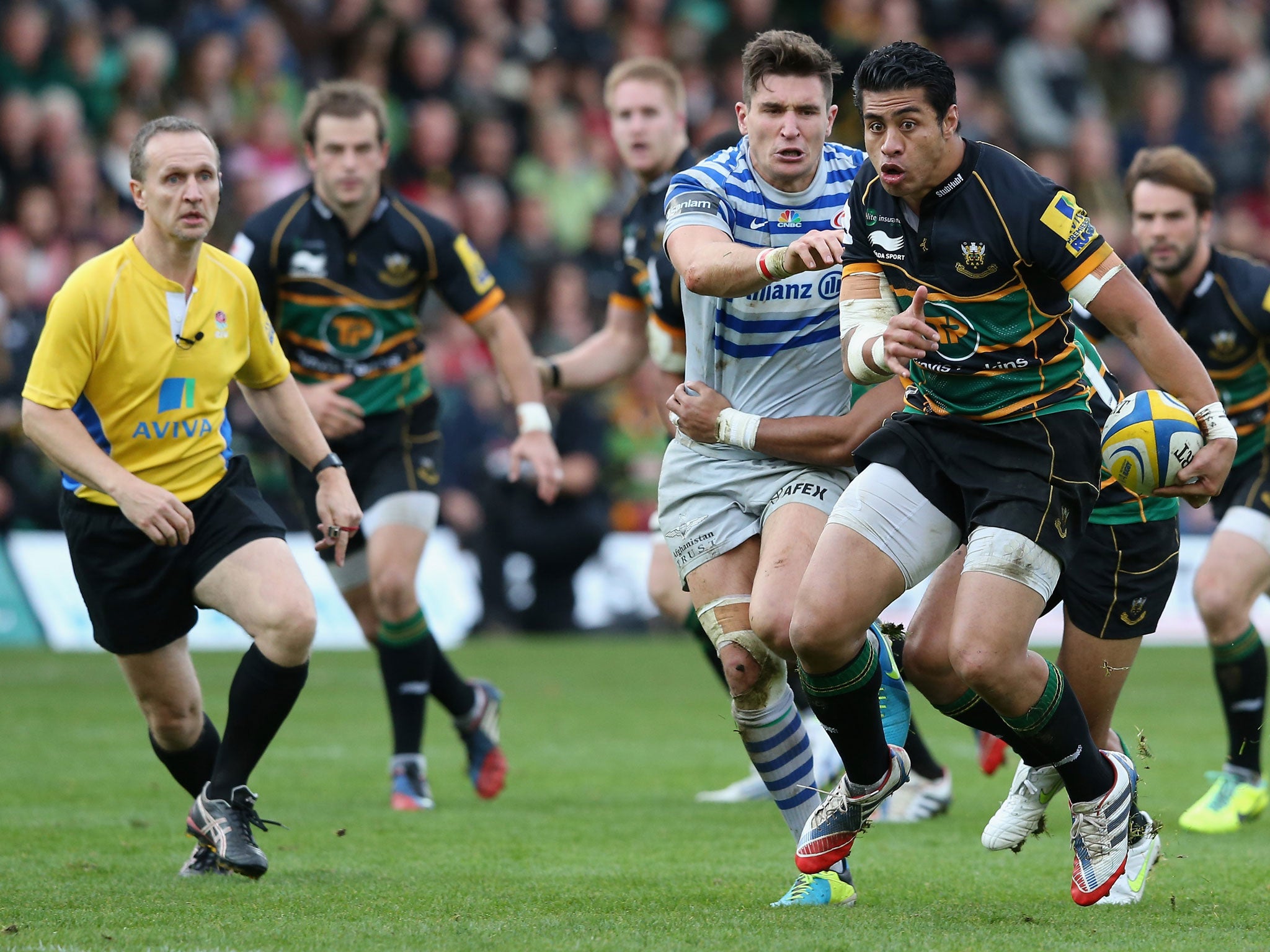 NORTHAMPTON, ENGLAND - OCTOBER 26: George Pisi of Northampton breaks with the ball during the Aviva Premiership match between Northampton Saints and Saracens at Franklin's Gardens