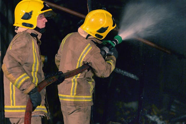 A fire crew attend a fire last year; Fire chiefs have warned the Home Office of the fire risk present in an immigration centre from damage five years ago 