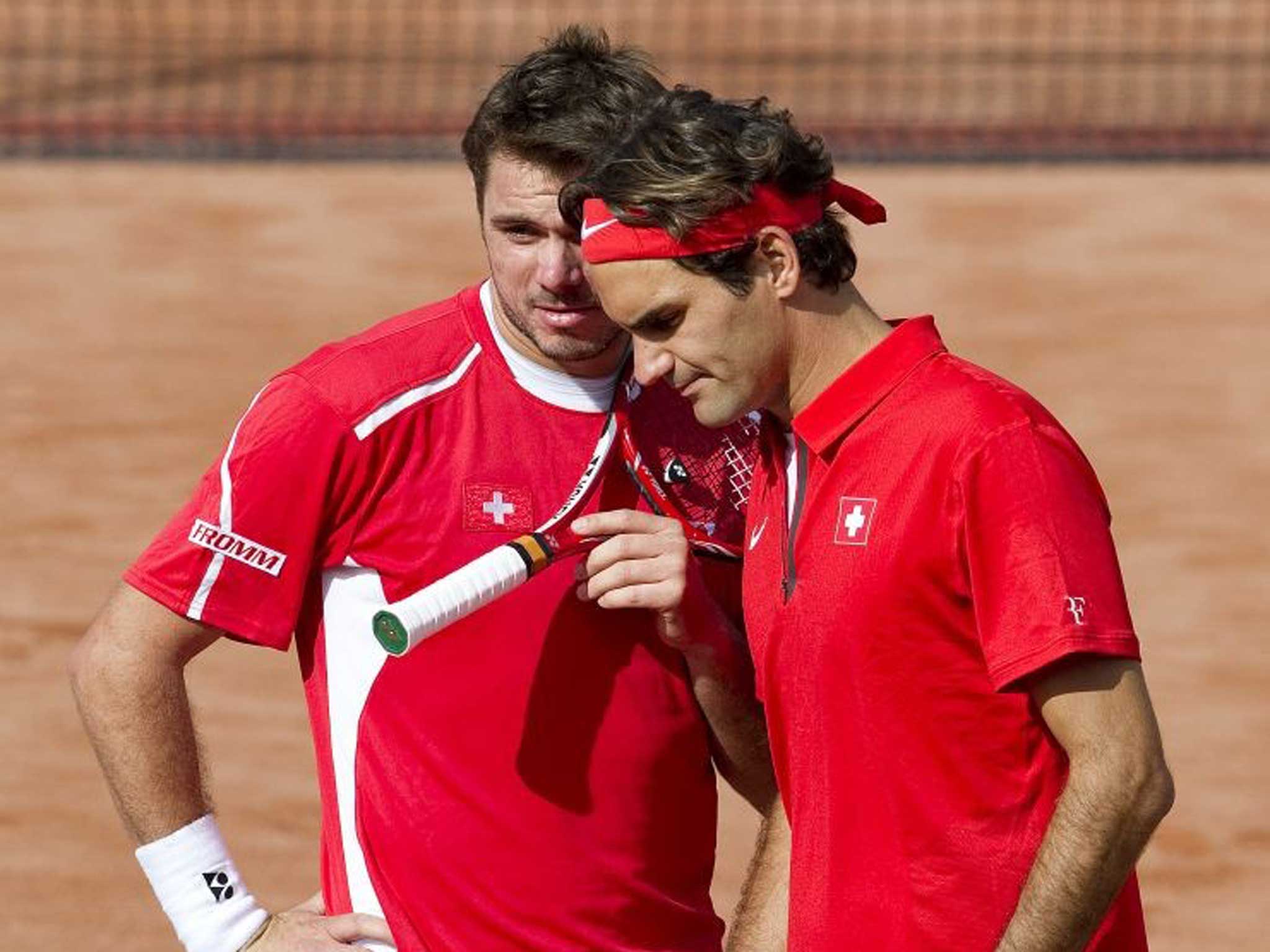 Friend and rival: Stanislas Wawrinka (left) with Roger Federer
