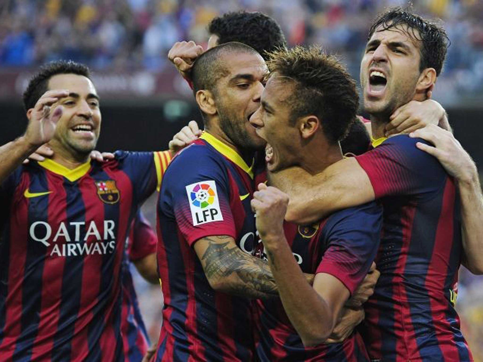 Home hero: Neymar (centre) is congratulated by his Barcelona team-mates but Gareth Bale had a disappointing day for Real Madrid