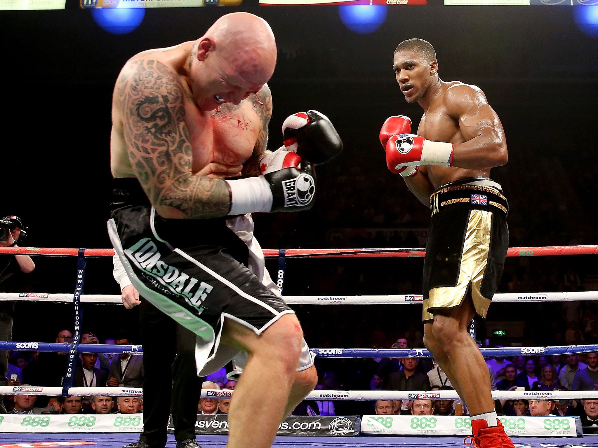 Joshua lands a blow on Paul Butlin, who he went on to stop inside two rounds last year