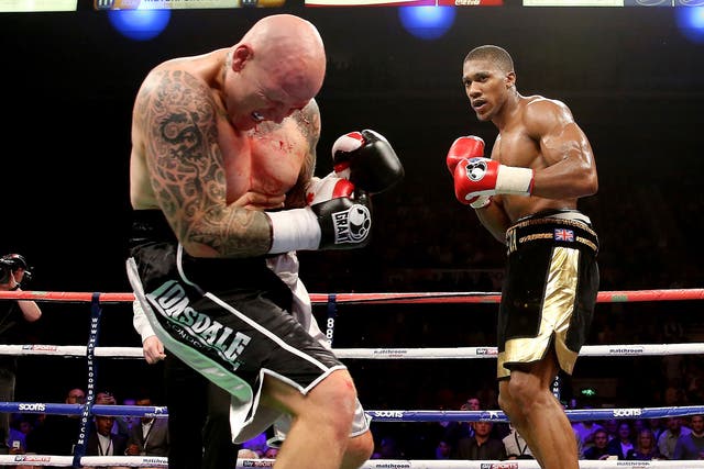 Anthony Joshua lands a blow on opponent Paul Butlin, who he went on to stop inside two rounds