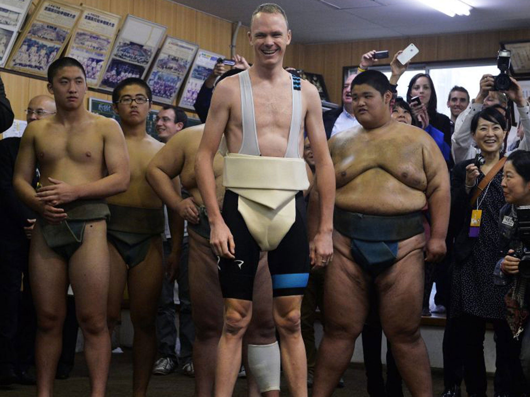 Chris Froome is all smiles as he takes part in some sumo wrestling training