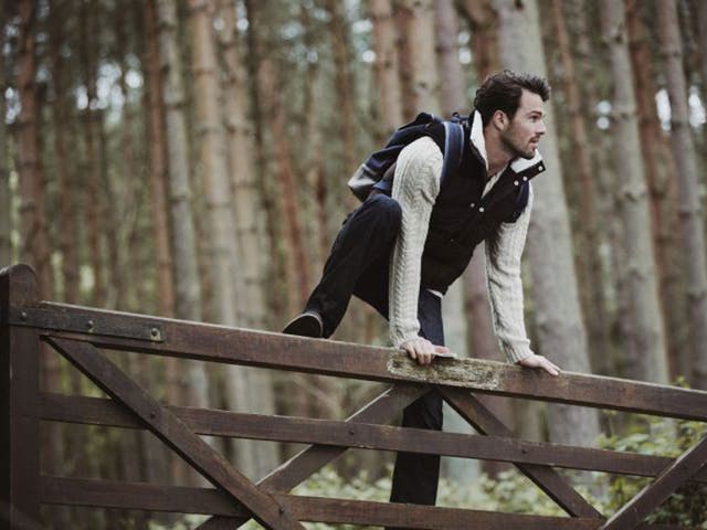 Wild and woolly: Model wears cable-knit jumper £70; padded gilet £70; navy trousers £55