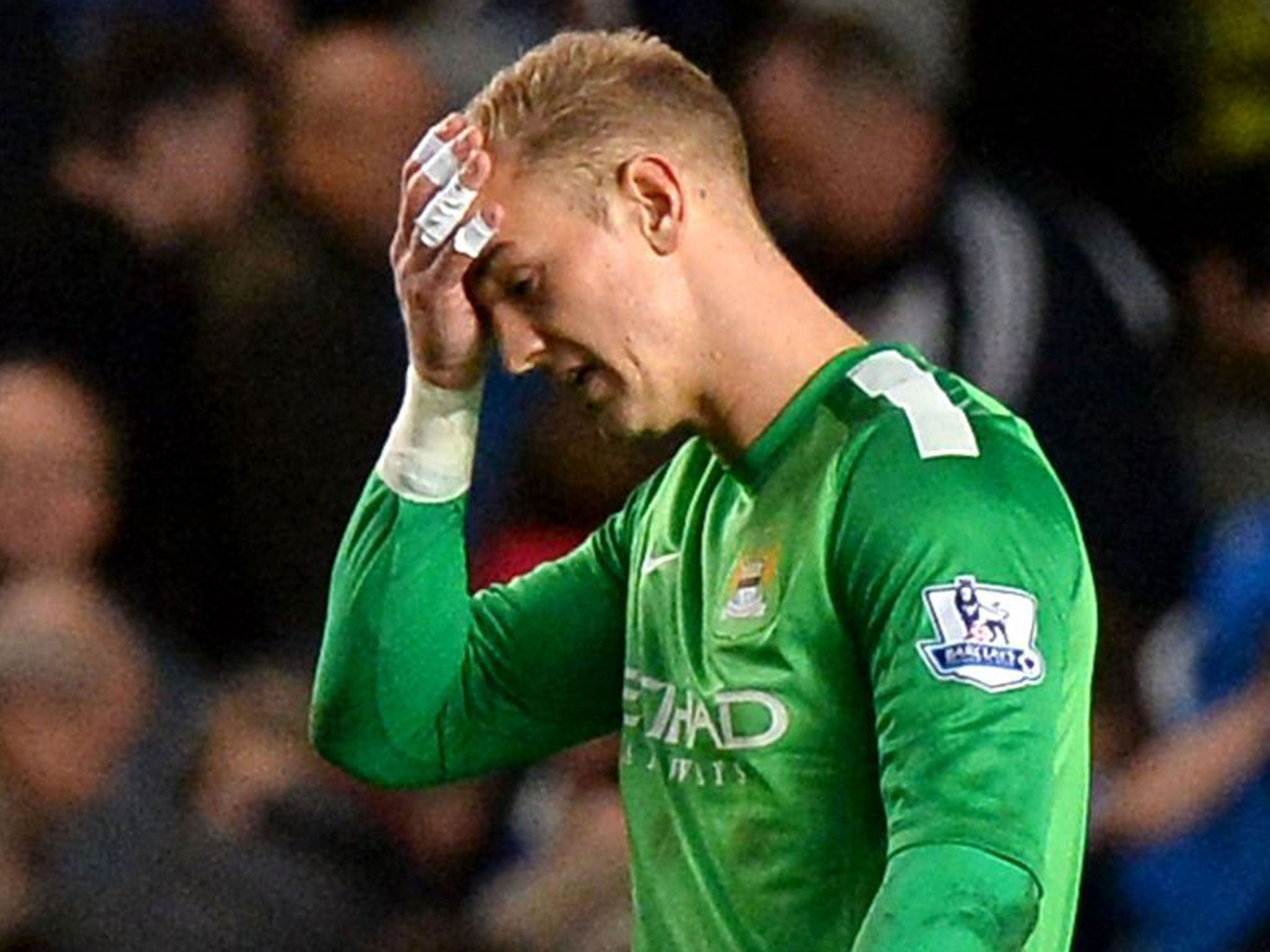 Joe Hart leaves the field distraught after conceding the late goal