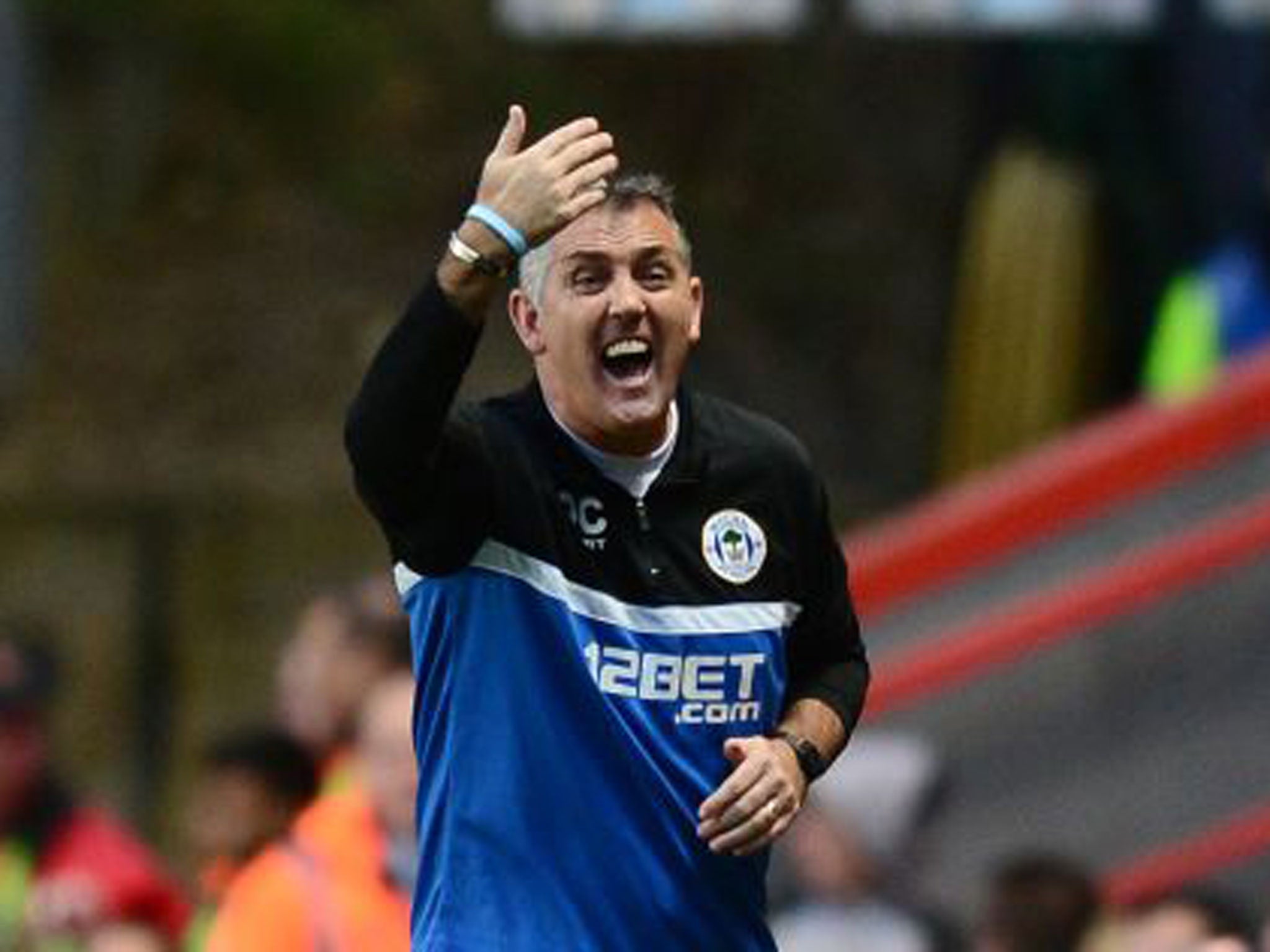 Wigan manager Owen Coyle makes a gesture from the touchline at The Valley
