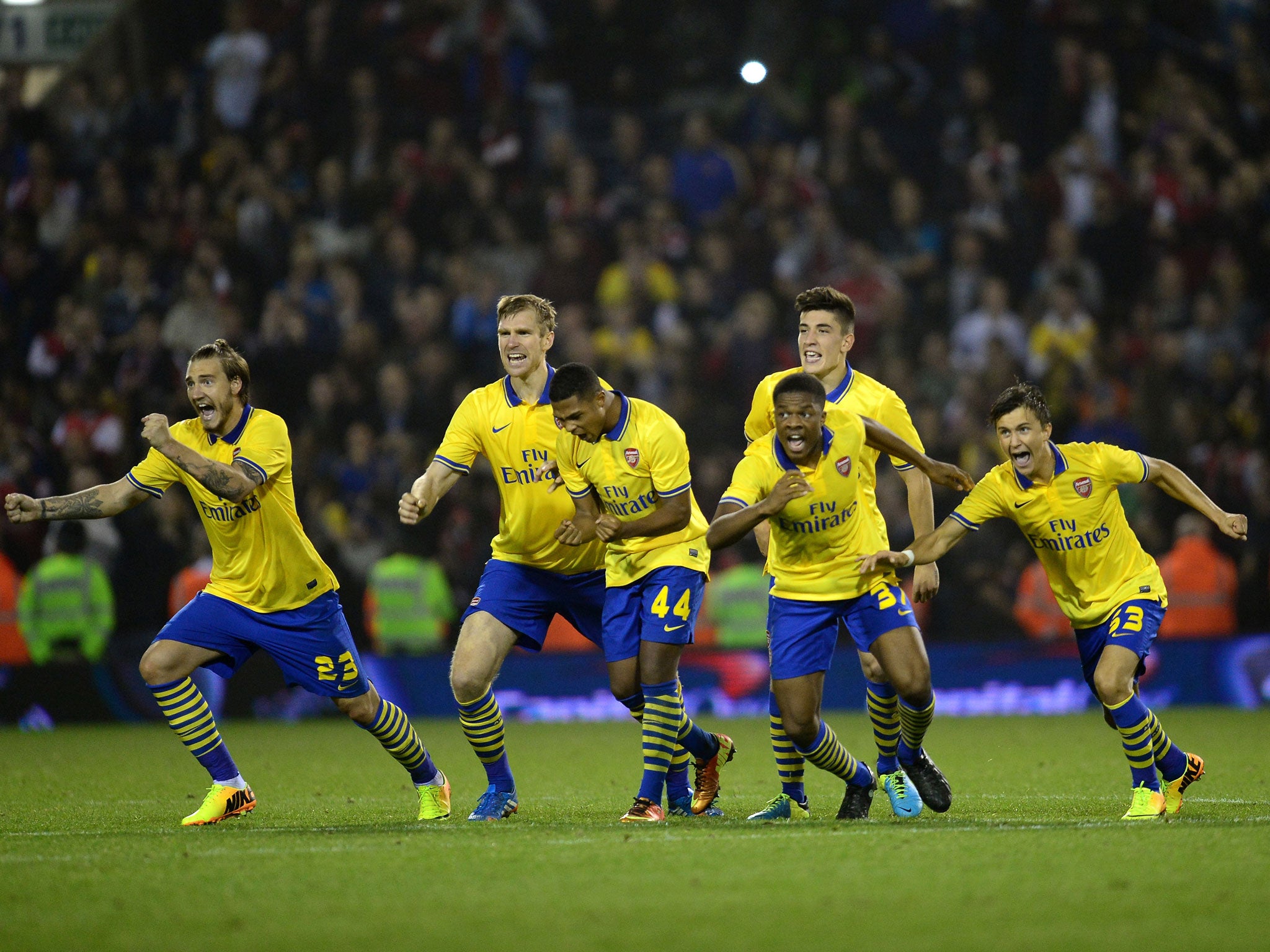 Arsenal’s young side celebrate their penalties win over West Bromwich Albion