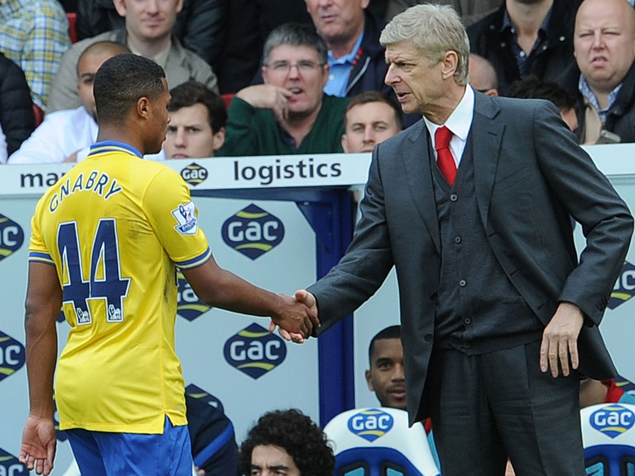 Arsene Wenger shakes hands with Serge Gnabry after he is substituted during Arsenal's 2-0 win at Crystal Palace on Saturday