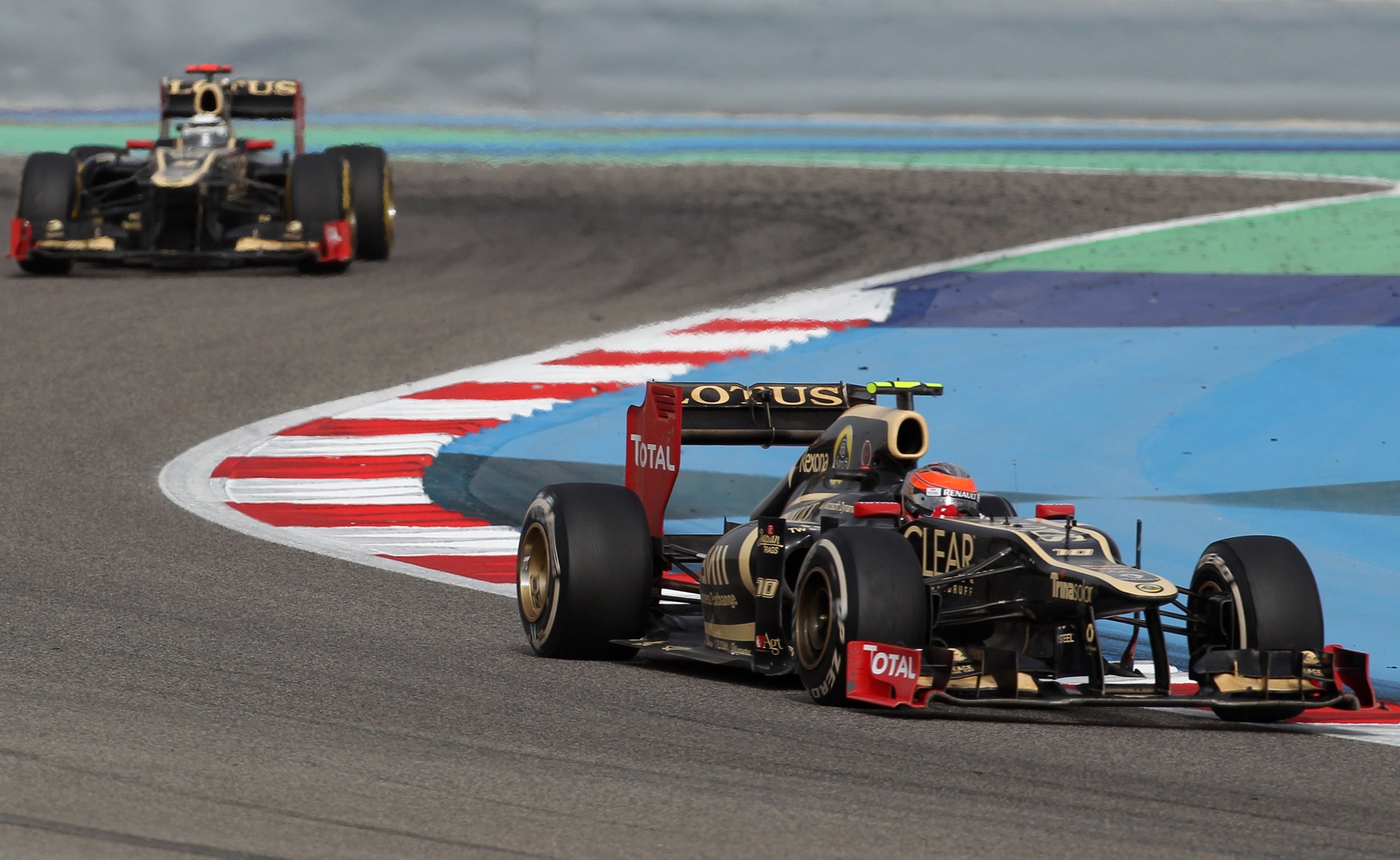 Kimi Raikkonen ahead of his Lotus team-mate Romain Grosjean