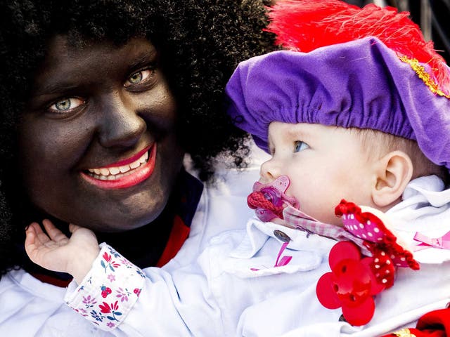 A woman dressed up as Zwarte Piet at the protest in The Hague on Saturday