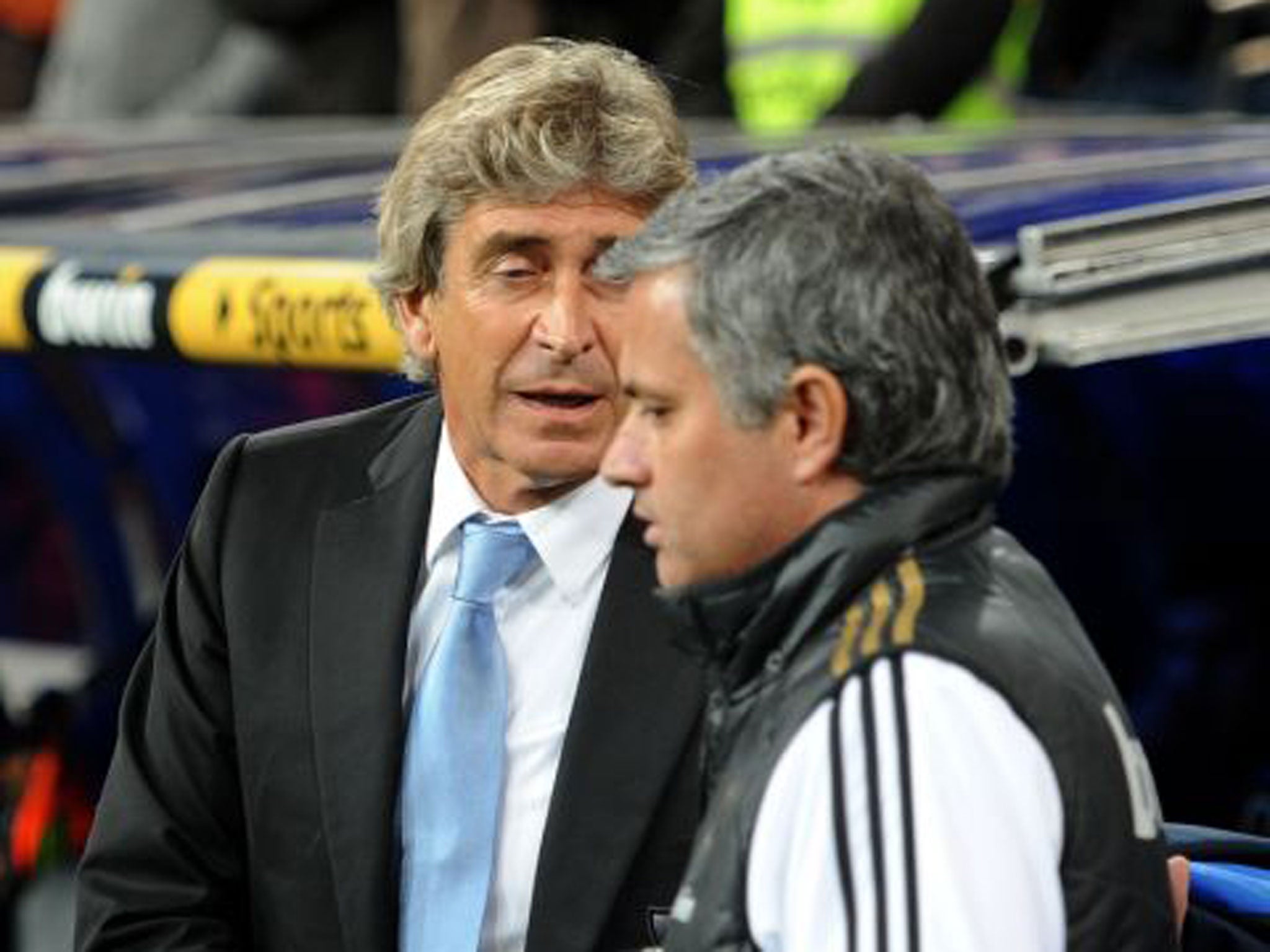 Manuel Pellegrini, then Malaga manager, shakes hands with Jose Mourinho who had taken over from him at Real Madrid