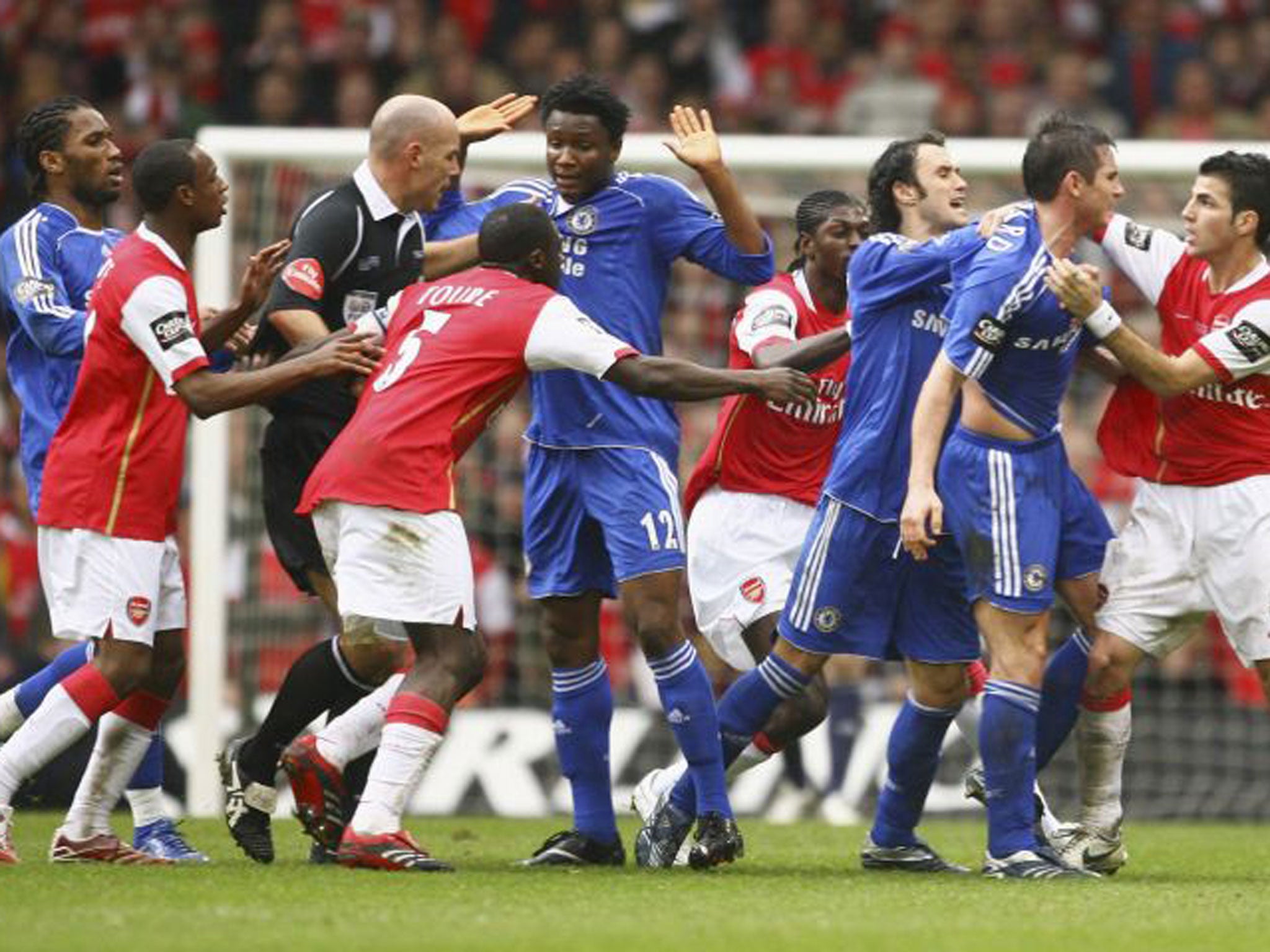 Arsenal and Chelsea players clash during the infamous ‘Snarling’ Cup final of 2007