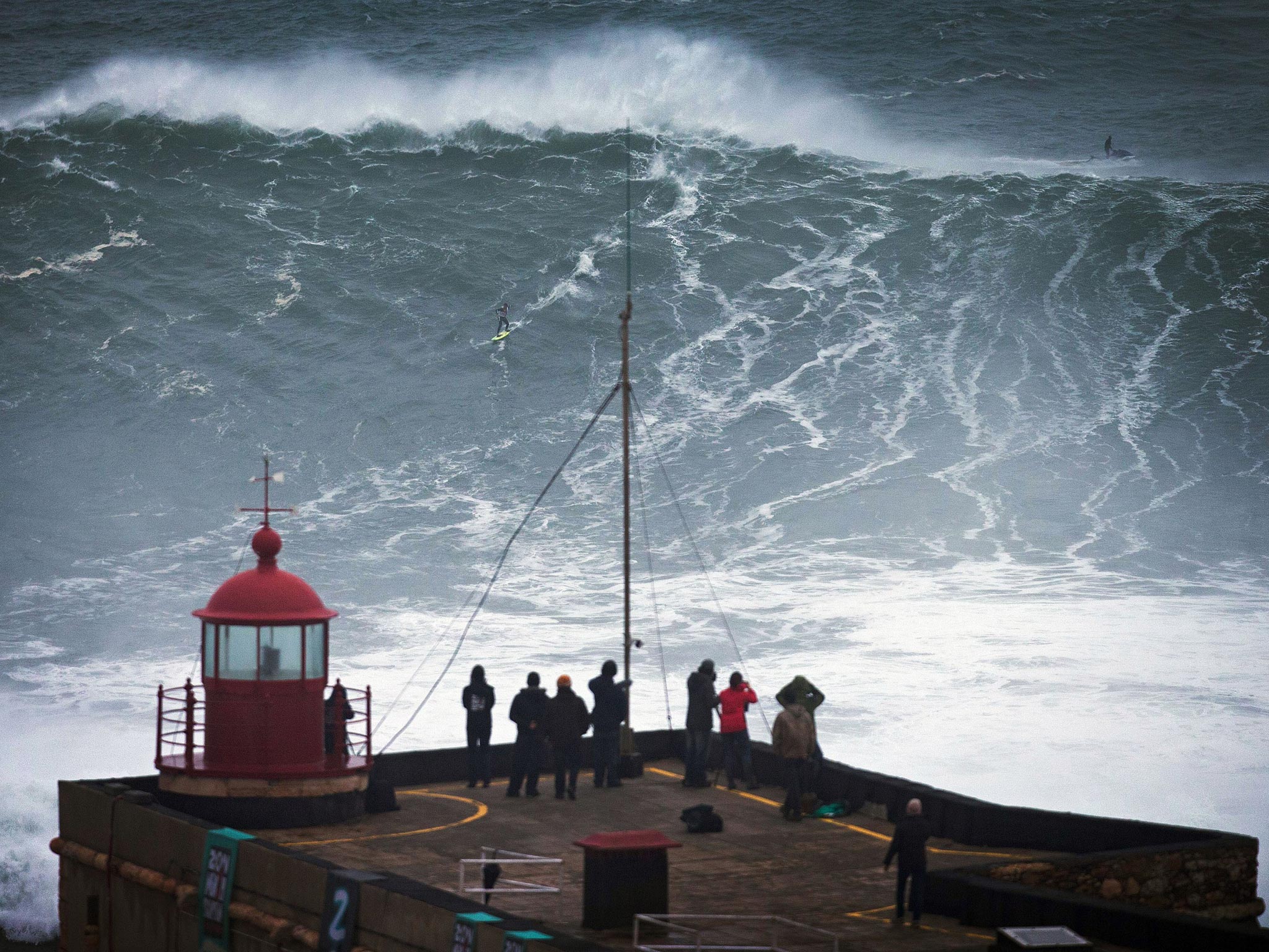 Surfers ride 'biggest ever' waves at Nazare during St Jude's Day storm ...