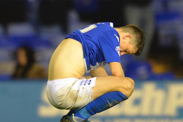 A dejected Callum Reilly of Birmingham City after missing a penalty 