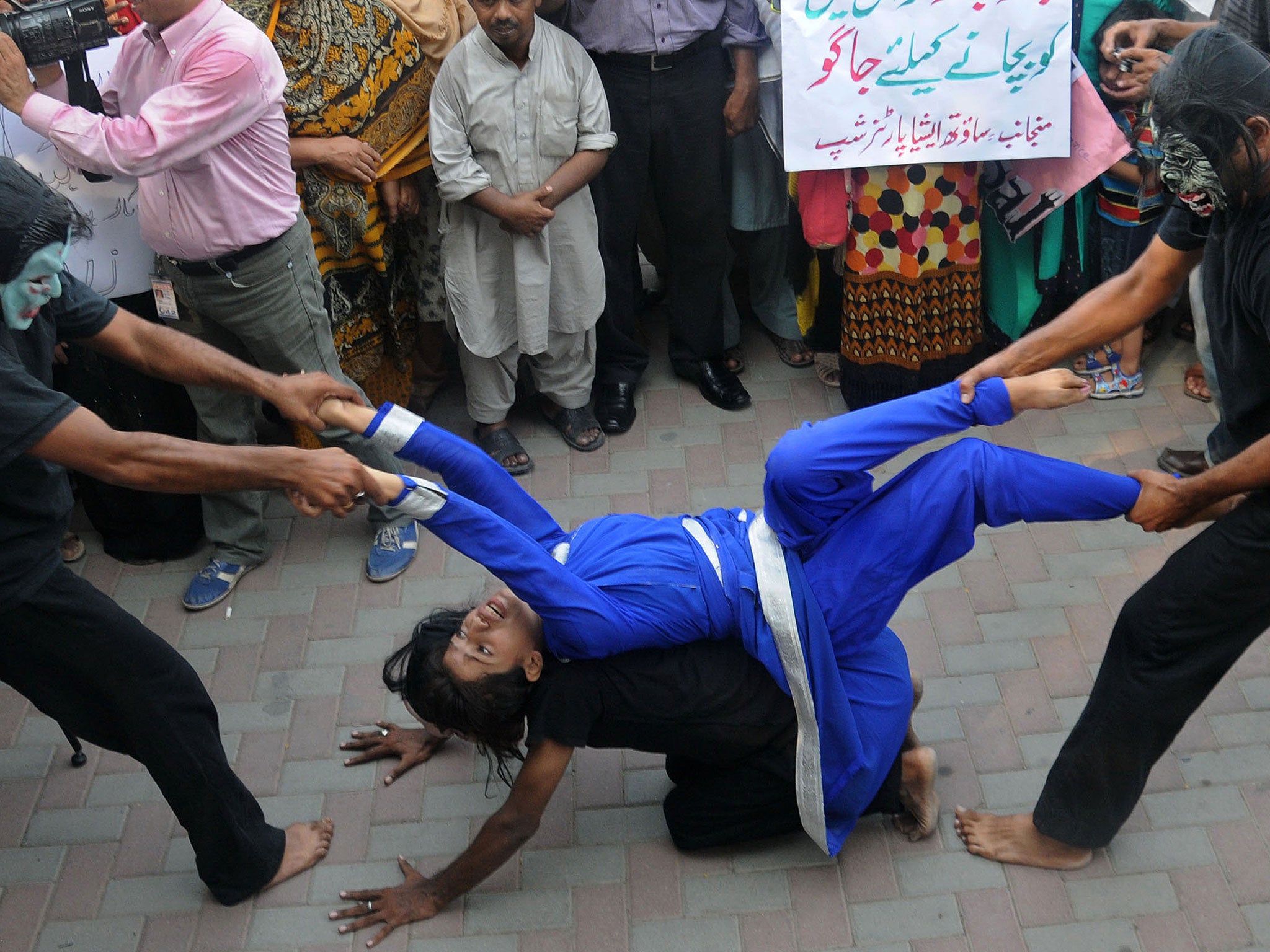 Pakistani workers from NGOs perform during an anti-rape protest in Lahore on 14 September