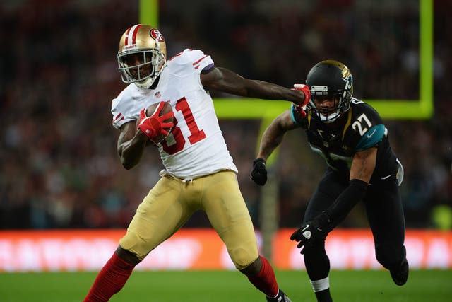 San Francisco 49ers wide receiver Anquan Boldin breaks free from a diving Dwanye Gratz of the Jacksonville Jaguars