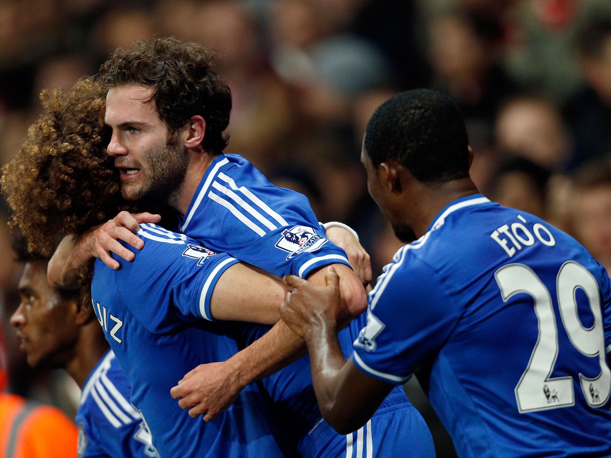 Chelsea's Spanish midfielder Juan Mata (C) celebrates scoring their second goal