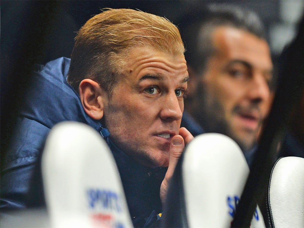 Under fire goalkeeper Joe Hart watches on from the bench