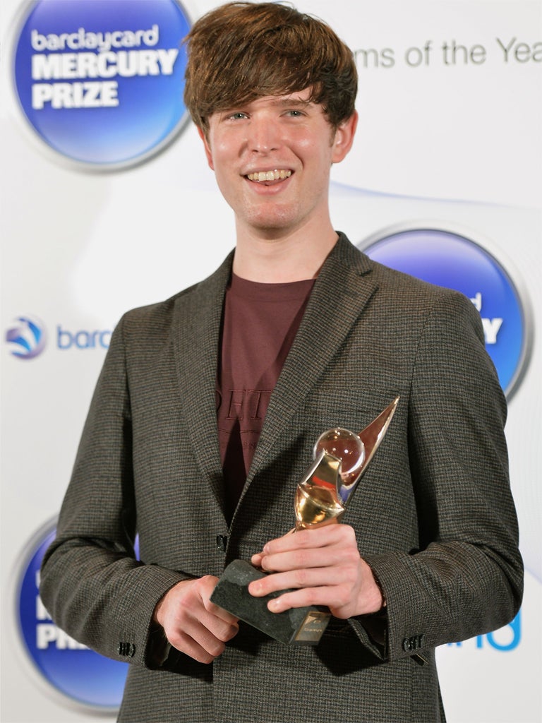 British singer-songwriter and producer James Blake poses with the Mercury Prize trophy