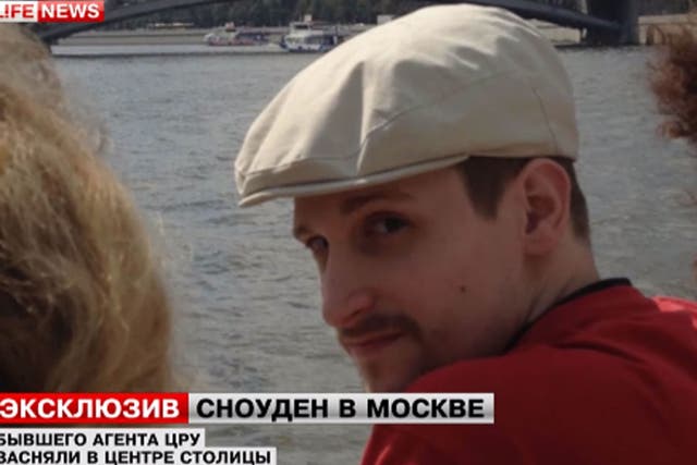 Edward Snowden, pictured here seeing the sites of Moscow, has found a job on a Russian website, his lawyer says