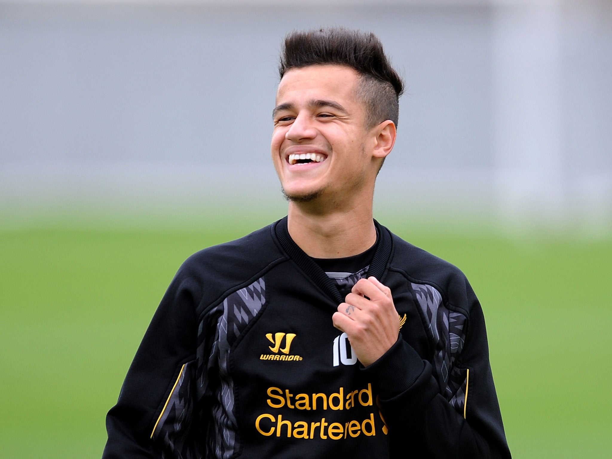 Philippe Coutinho is all smiles during training with Liverpool on Thursday