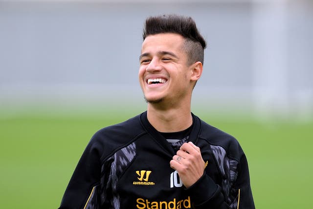 Philippe Coutinho is all smiles during training with Liverpool on Thursday