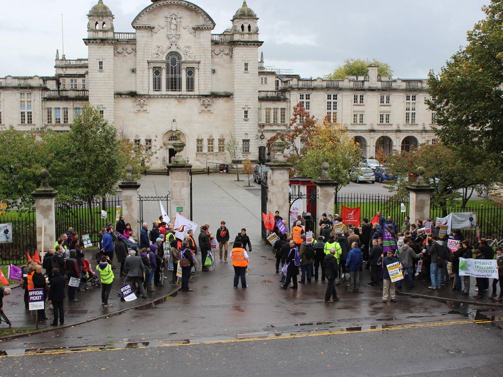 Protesters gather at the gates to Cardiff University