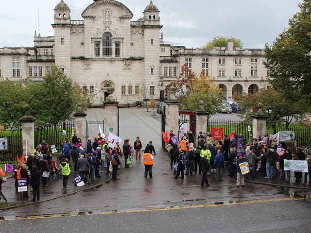 Protesters gather at the gates to Cardiff University