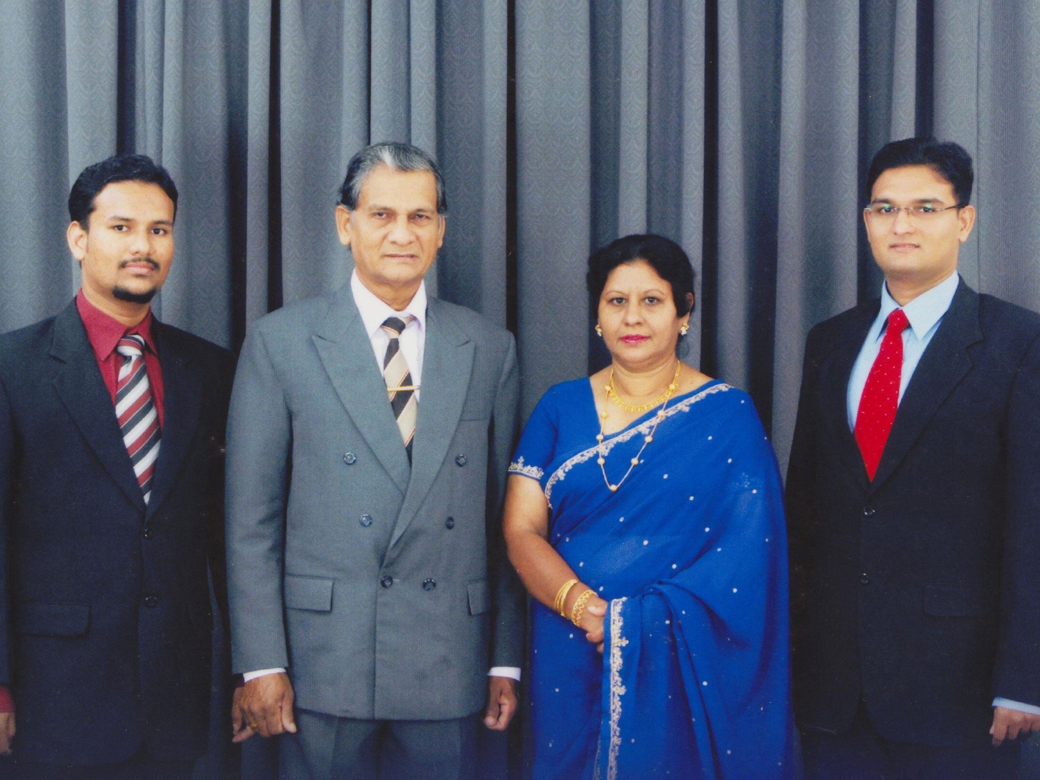 Thavisha Lakindu Peiris (far right) with his parents, his father Sarath Mahinda Peiris (second left) and mother Sudarma Narangoda