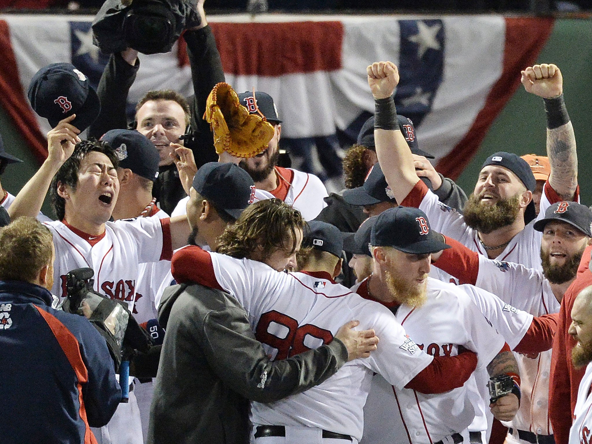 The Boston Red Sox celebrate winning the World Series at their home, Fenway Park