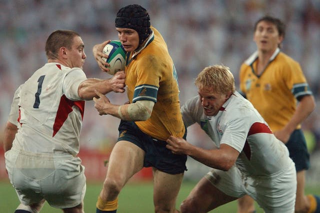 Lewis Moody (right) lines up a tackle on Australia's Stephen Larkham during the World Cup final in Sydney 10 years ago 
