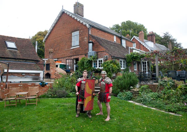 Tom and Ogi Augarde, who make their own armour, shields and swords at the village forge, are part of a 20-strong Roman battalion which marches in Robertsbridge