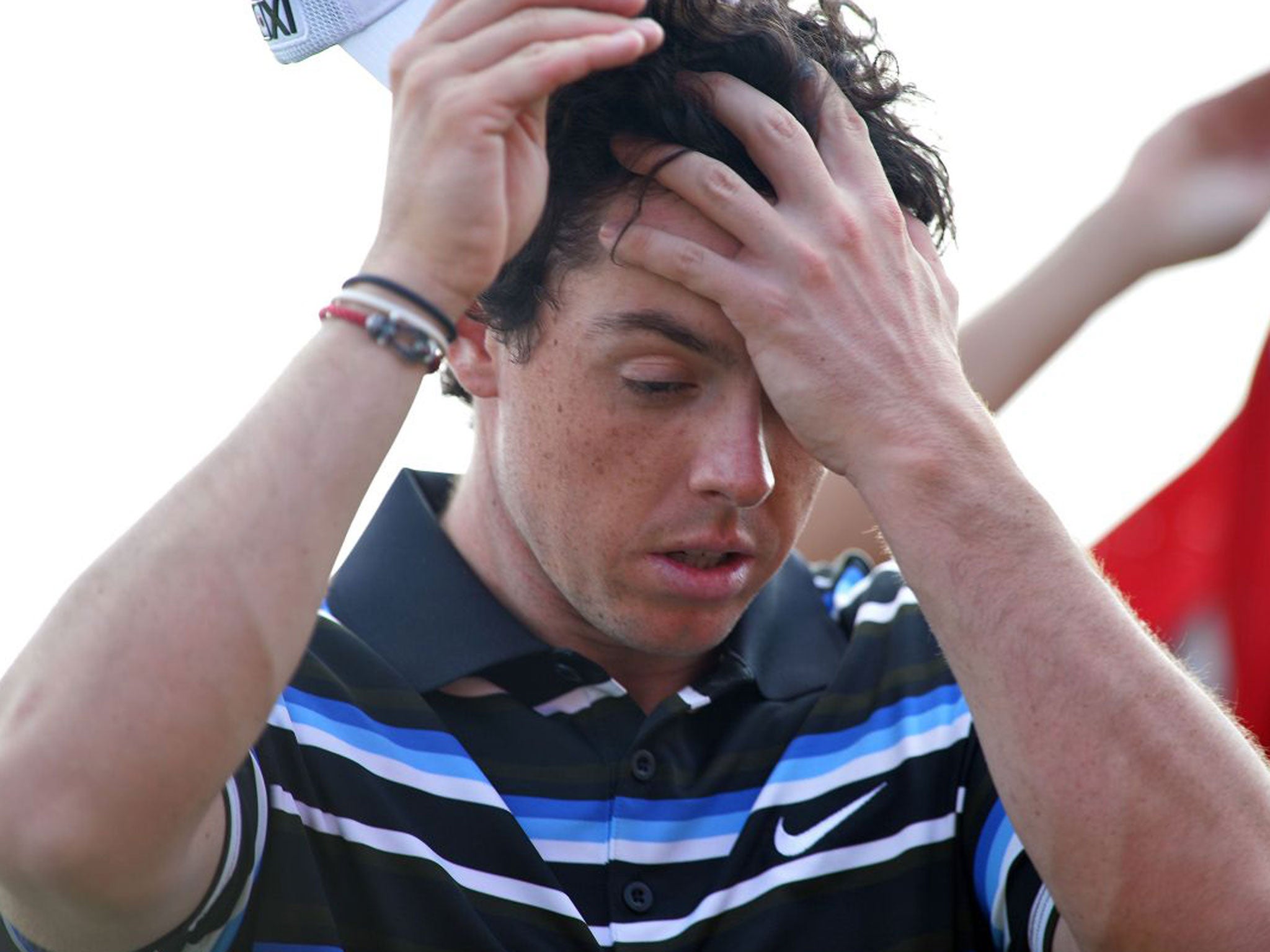 Rory McIlroy reacts after recording another bogey on the 18th