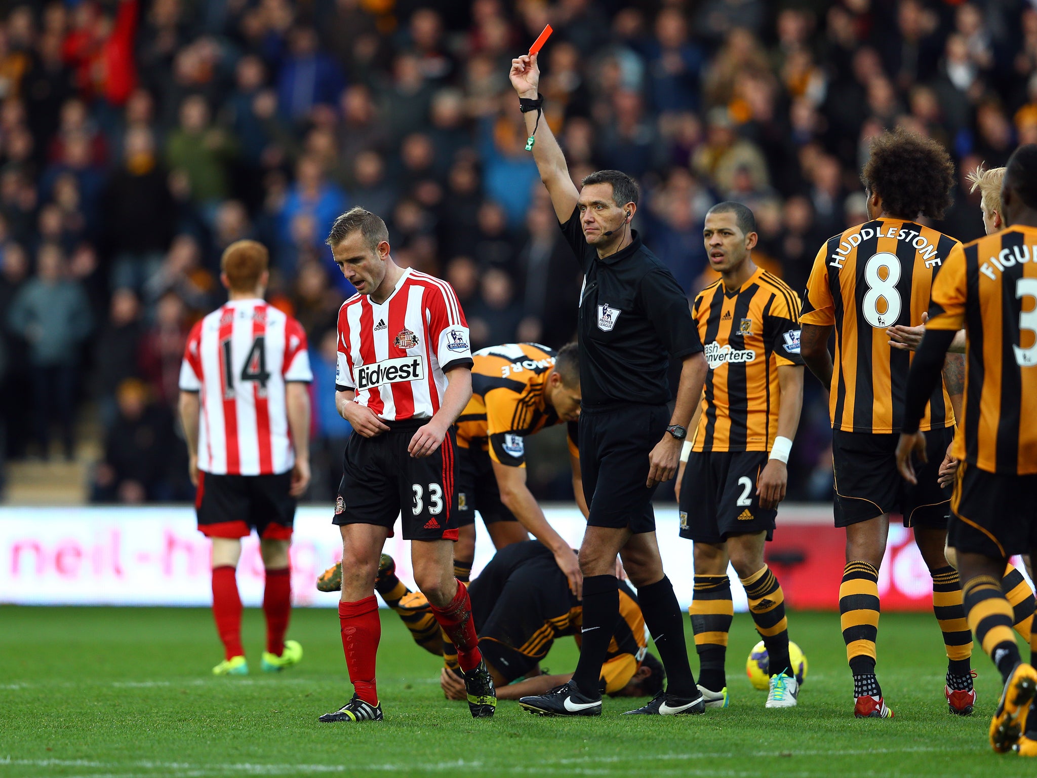 Lee Cattermole is shown a straight red card for Sunderland