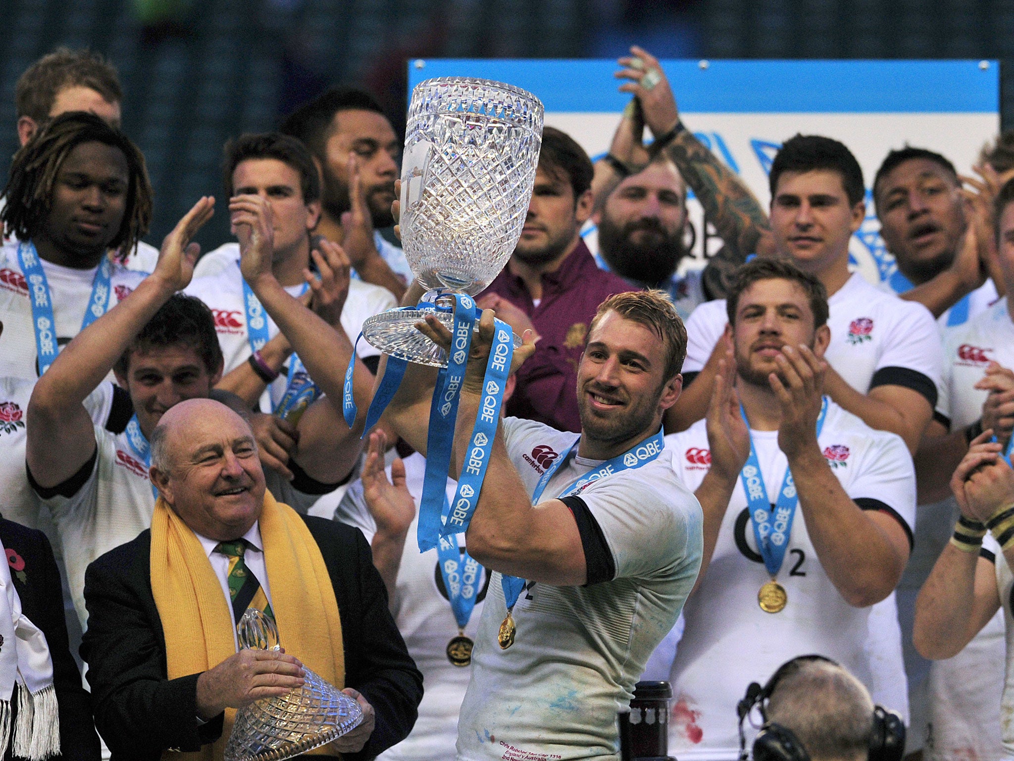LONDON, ENGLAND - NOVEMBER 02: England's captain Chris Robshaw holds the QBE trophy as the team celebrates beating Australia 20-13 during the International rugby union test match between England and Australia at Twickenham Stadium
