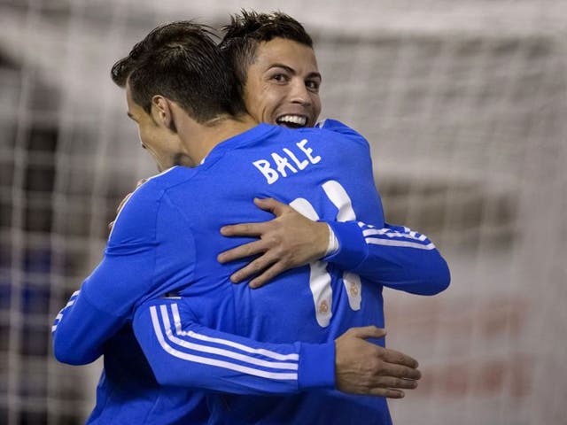Cristiano Ronaldo (right) celebrates with Gareth Bale, who created his second goal in the 3-2 win at Rayo Vallecano on Saturday