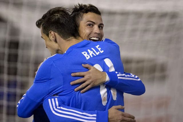 Cristiano Ronaldo (right) celebrates with Gareth Bale, who created his second goal in the 3-2 win at Rayo Vallecano on Saturday