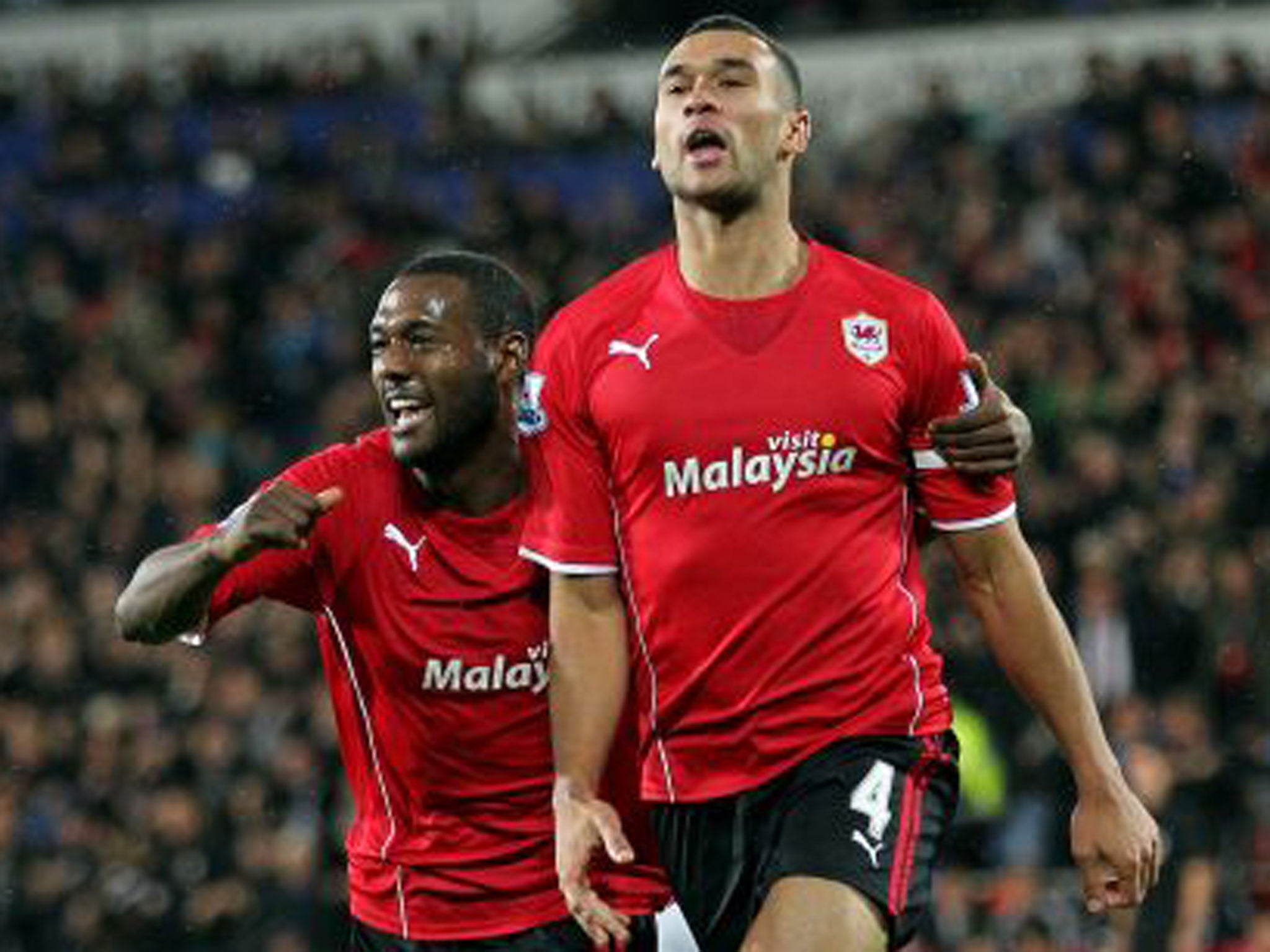 Cardiff City's Steven Caulker celebrates his winner with team-mate Kevin Theophile-Catherine