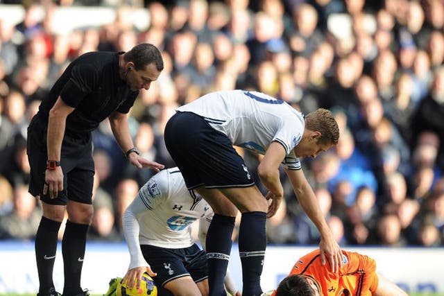 Tottenham goalkeeper Hugo Lloris lies stricken on the Goodison Park pitch after colliding with Romelu Lukaku