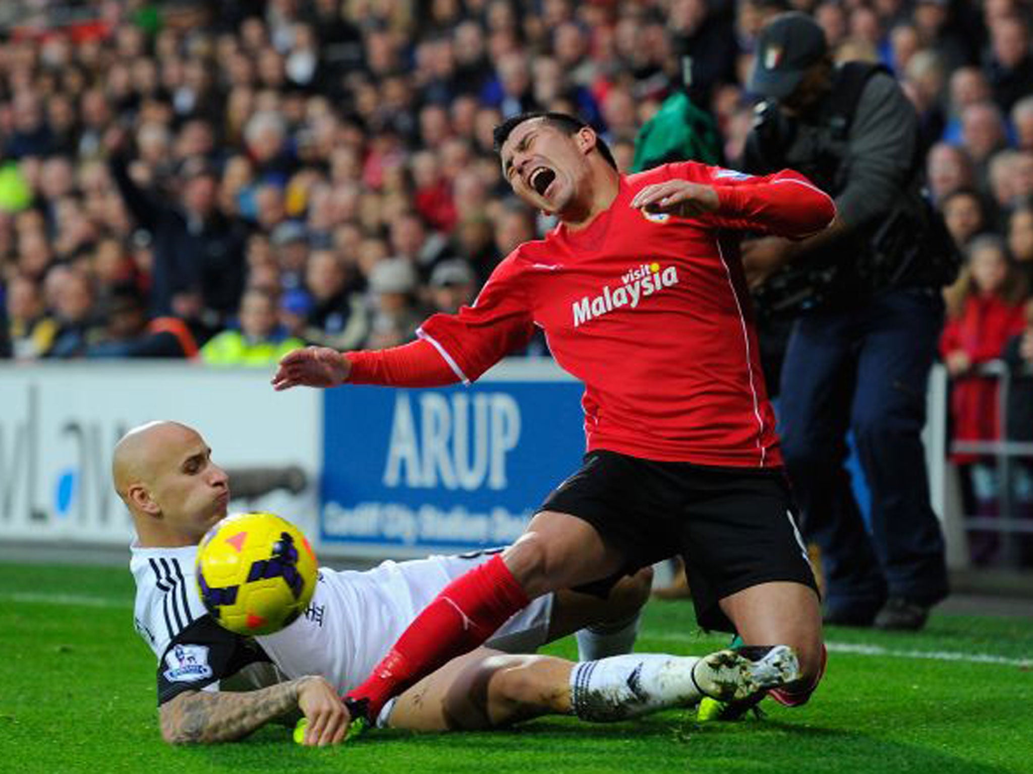 Swansea’s Jonjo Shelvey challenges Gary Medel on Sunday