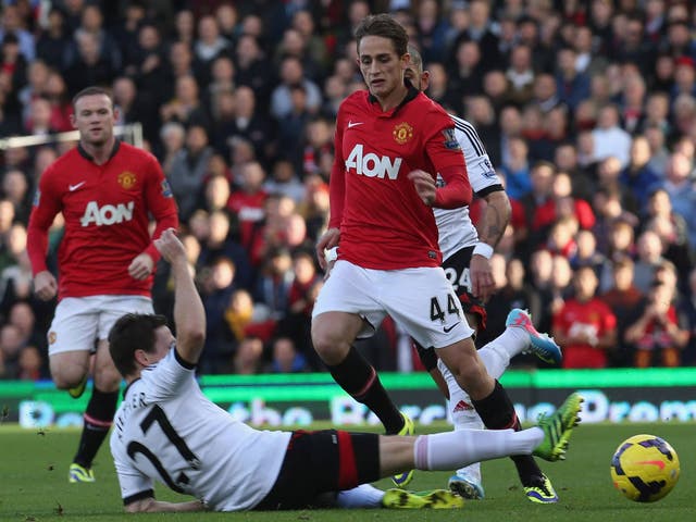 Adnan Januzaj is tackled by Sacha Reither