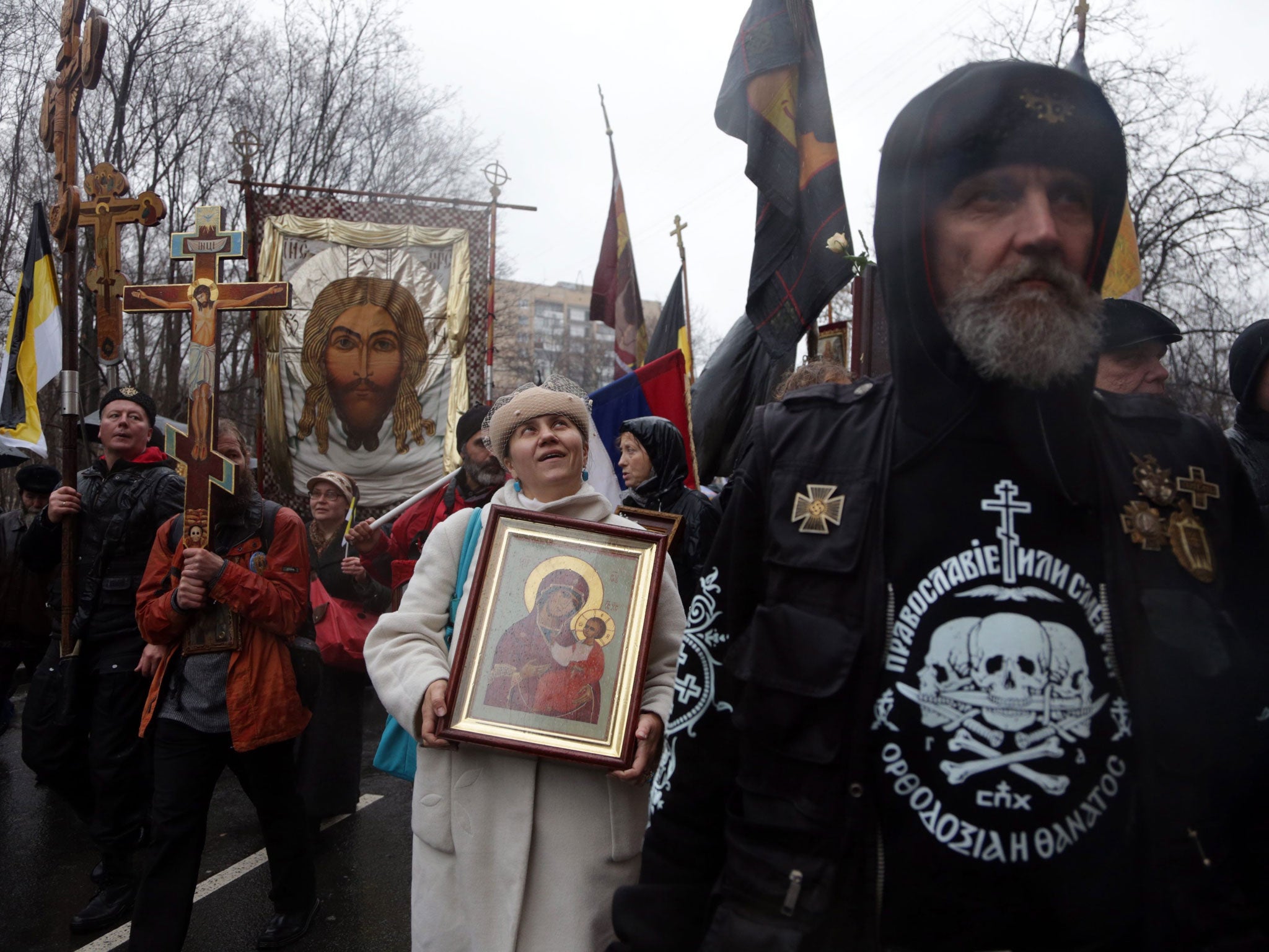 People take part in a march held under the slogan 'For belief, tsar and fatherland' in Moscow. The march organized on the National Unity Day is devoted to the 400-year anniversary of Romanov imperial house