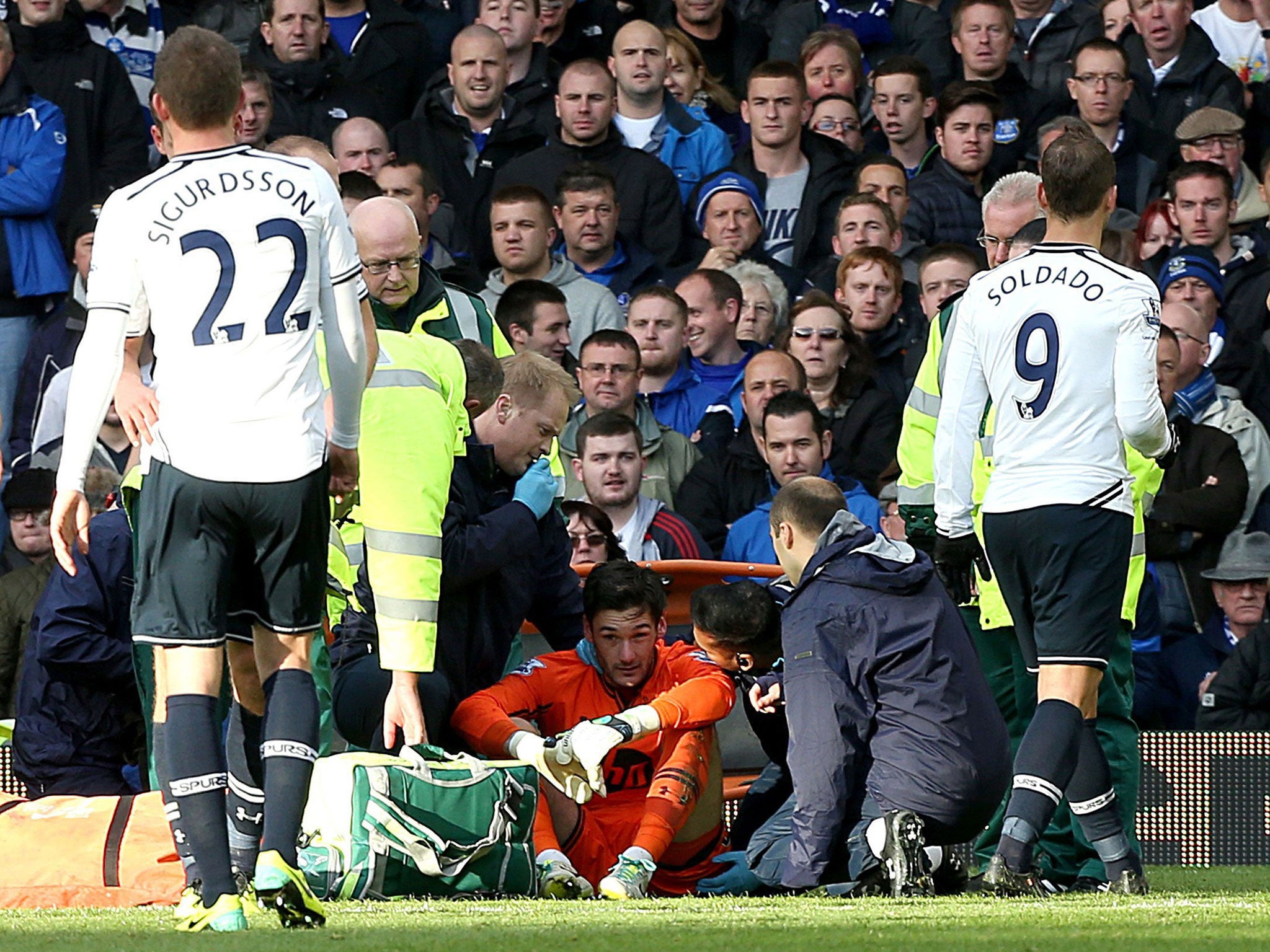 Spurs' Hugo Lloris receives treatment before returning to the pitch