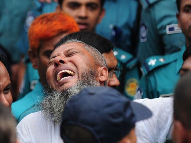 A Bangladesh Rifles soldier gestures following the announcement of his death penalty at the special court in Dhaka as it sentenced at least 150 soldiers to death over a 2009 military mutiny