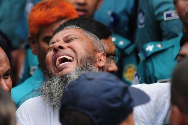 A Bangladesh Rifles soldier gestures following the announcement of his death penalty at the special court in Dhaka as it sentenced at least 150 soldiers to death over a 2009 military mutiny