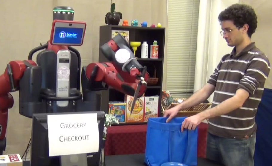 A still from Cornell's video shows Baxter (the robot) correctly not stabbing a human.